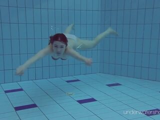 White swimsuit with tattoos – diva Roxalana Cheh underwater